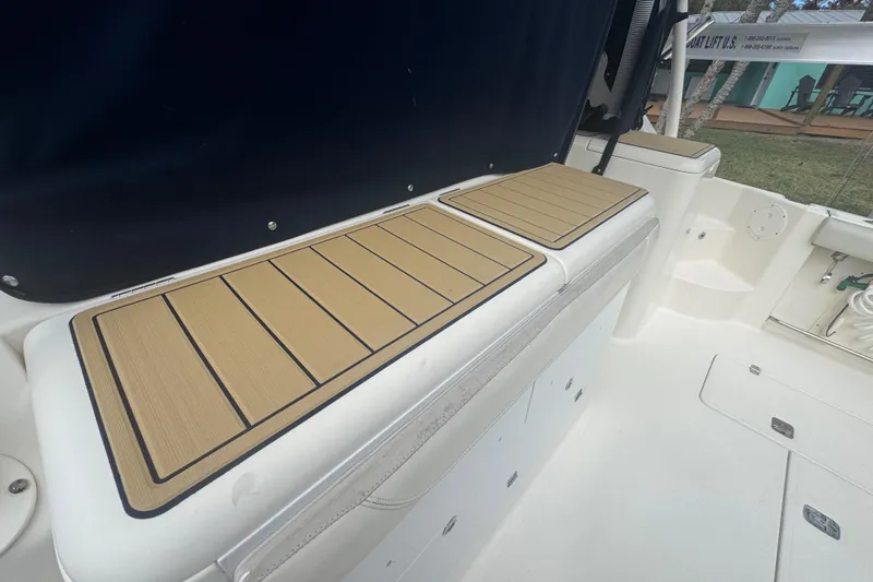  Yacht Photos Pics 2014 Pursuit OS 345 Offshore boat interior with cushioned seating and deck.