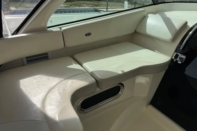  Yacht Photos Pics 2014 Pursuit OS 345 Offshore interior seating with beige upholstery and sleek design.