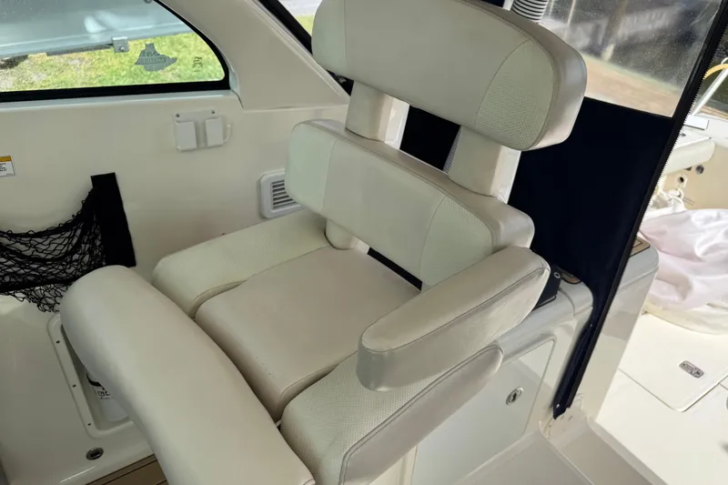  Yacht Photos Pics 2014 Pursuit OS 345 Offshore boat interior with cushioned seating.