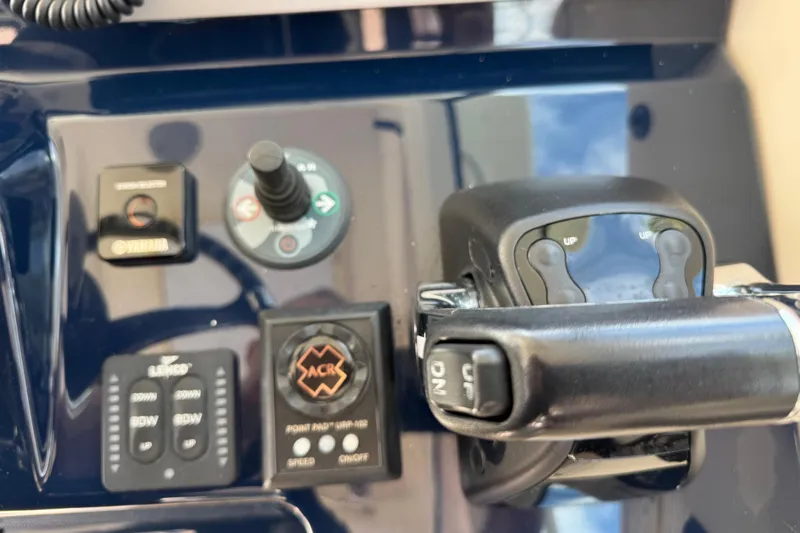  Yacht Photos Pics Control panel of 2014 Pursuit OS 345 Offshore boat with various switches and levers.