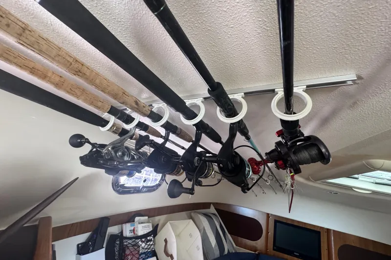  Yacht Photos Pics Fishing rods stored in cabin of 2014 Pursuit OS 345 Offshore boat.