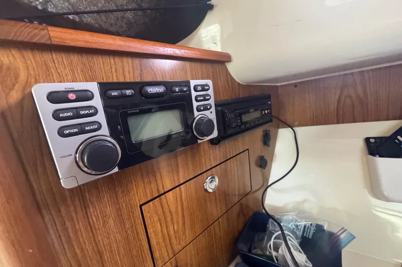  Yacht Photos Pics 2014 Pursuit OS 345 Offshore cabin with Clarion audio system and wood paneling.