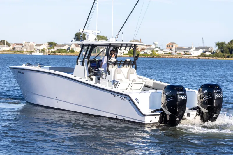  Yacht Photos Pics 2020 Freeman 34VH boat with twin Mercury 400 engines on a calm waterway.