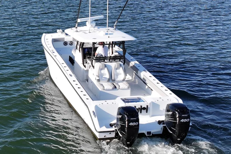  Yacht Photos Pics Freeman 34VH 2020 boat cruising on open water with twin Mercury engines.