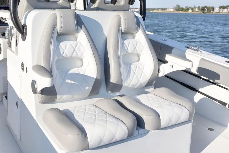  Yacht Photos Pics Luxurious seating on a 2020 Freeman 34VH boat, featuring white and gray cushioned seats.