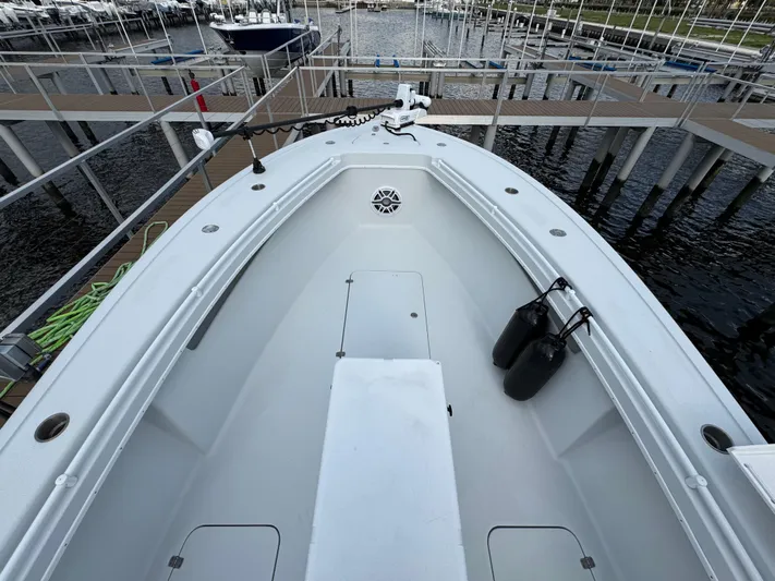  Yacht Photos Pics 2003 Yellowfin 36 Offshore boat docked at marina, view of bow and deck.