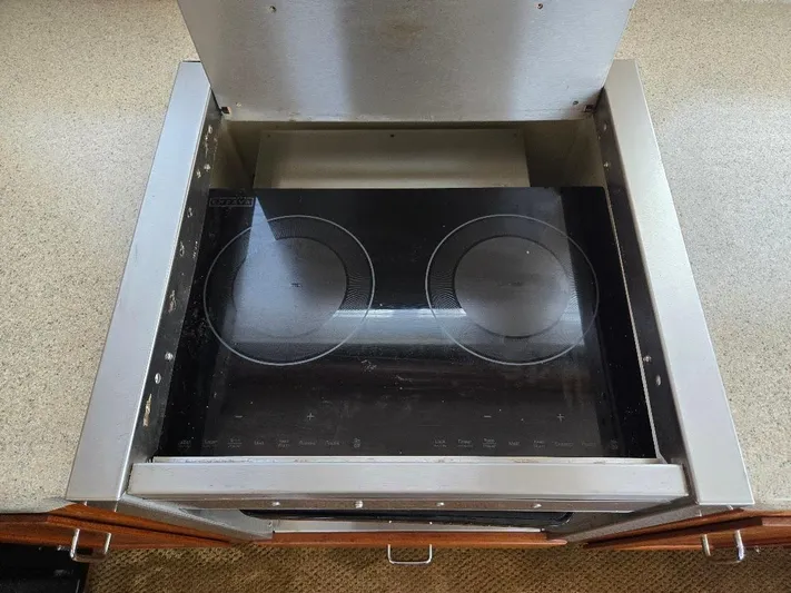 Ecola Yacht Photos Pics Electric cooktop in a 2005 American Tug 34 Pilothouse kitchen.