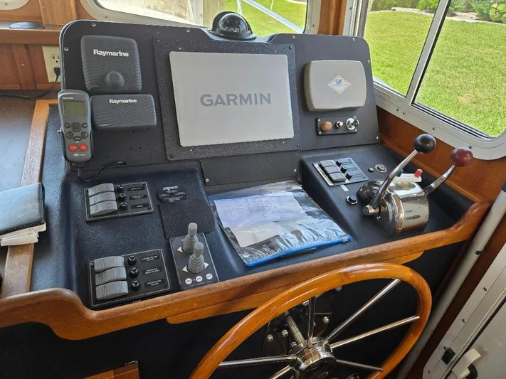 Ecola Yacht Photos Pics Pilothouse of 2005 American Tug 34 with Garmin and Raymarine navigation equipment.