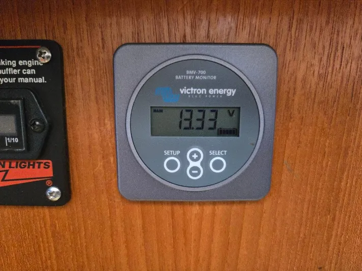 Ecola Yacht Photos Pics Victron Energy battery monitor on 2005 American Tug 34 Pilothouse, displaying 13.33 volts.