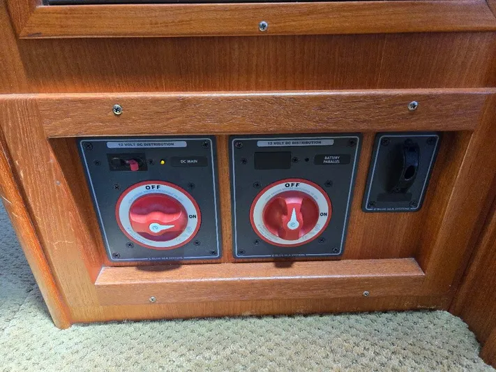 Ecola Yacht Photos Pics Control panel of a 2005 American Tug 34 Pilothouse with red switches.