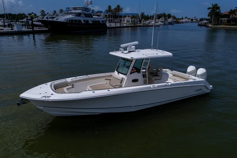 Ducky's Dinghy Yacht Photos Pics 2020 Boston Whaler 330 Outrage boat docked in a marina.