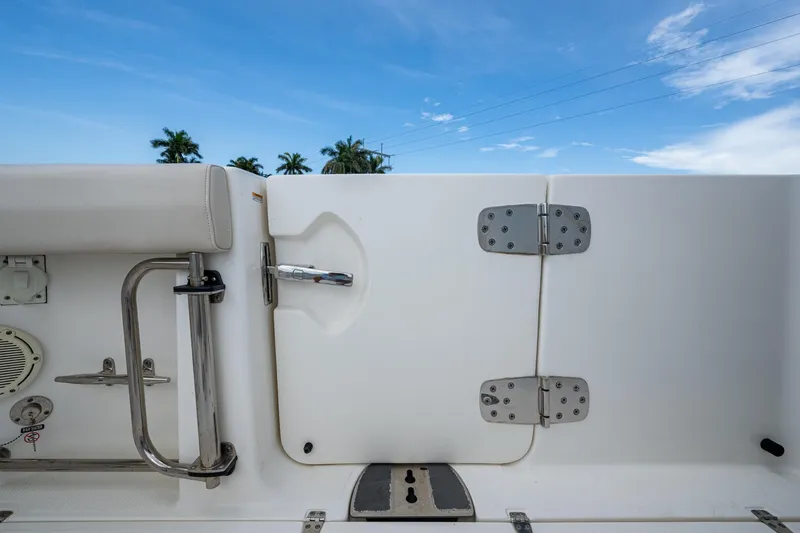 Ducky's Dinghy Yacht Photos Pics 2020 Boston Whaler 330 Outrage boat deck with stainless steel fittings and blue sky.