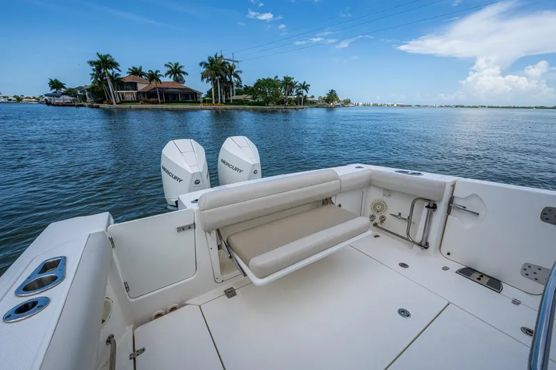 Ducky's Dinghy Yacht Photos Pics 2020 Boston Whaler 330 Outrage boat with dual Mercury engines on calm water.