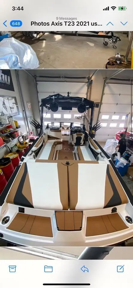 2021 Axis T23 boat in garage, featuring sleek interior design and modern amenities.