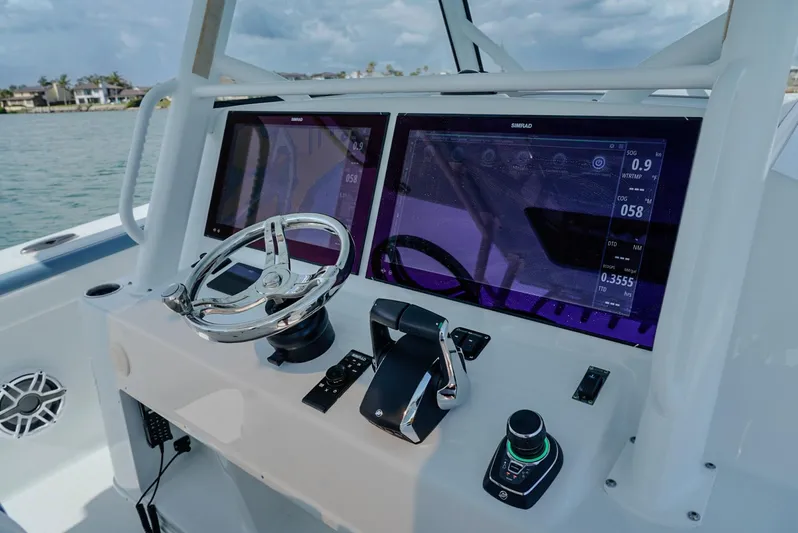  Yacht Photos Pics 2023 Yellowfin 42 boat dashboard with advanced navigation controls and dual displays.