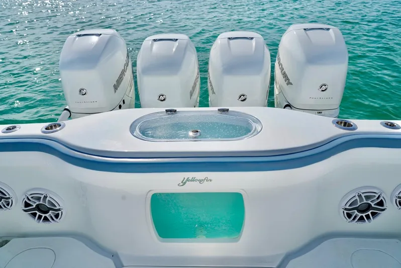  Yacht Photos Pics 2023 Yellowfin 42 boat with four Mercury outboard engines on turquoise water.