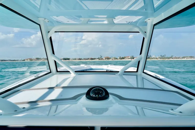  Yacht Photos Pics 2023 Yellowfin 42 boat interior with ocean view through windshield.