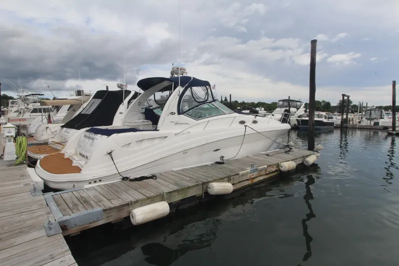  Yacht Photos Pics 2008 Sea Ray 340 Sundancer docked at marina under cloudy sky.