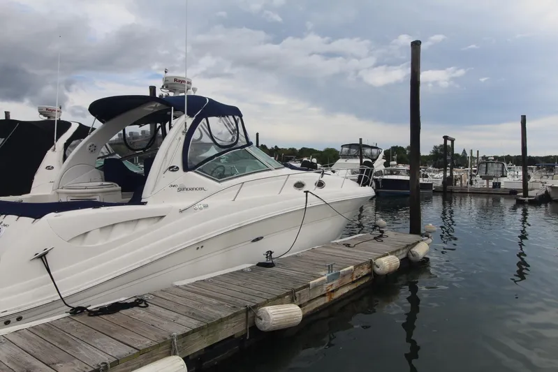  Yacht Photos Pics 2008 Sea Ray 340 Sundancer docked at a marina under cloudy skies.