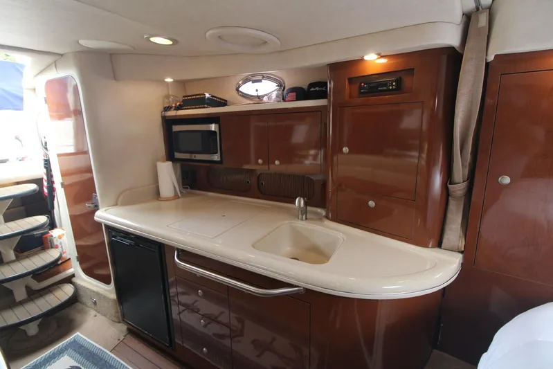  Yacht Photos Pics Interior of 2008 Sea Ray 340 Sundancer yacht with kitchenette and modern amenities.