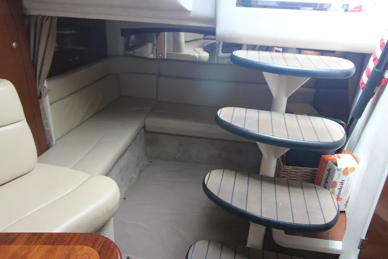  Yacht Photos Pics Interior of 2008 Sea Ray 340 Sundancer with beige seating and curved steps.
