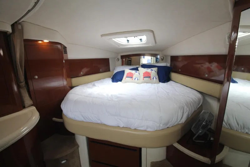  Yacht Photos Pics Luxurious cabin interior of 2008 Sea Ray 340 Sundancer with cozy bed and elegant wood finish.