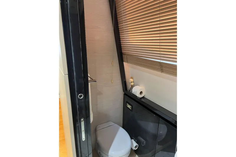  Yacht Photos Pics Luxurious bathroom in 2015 Azimut 80 yacht with modern fixtures and blinds.