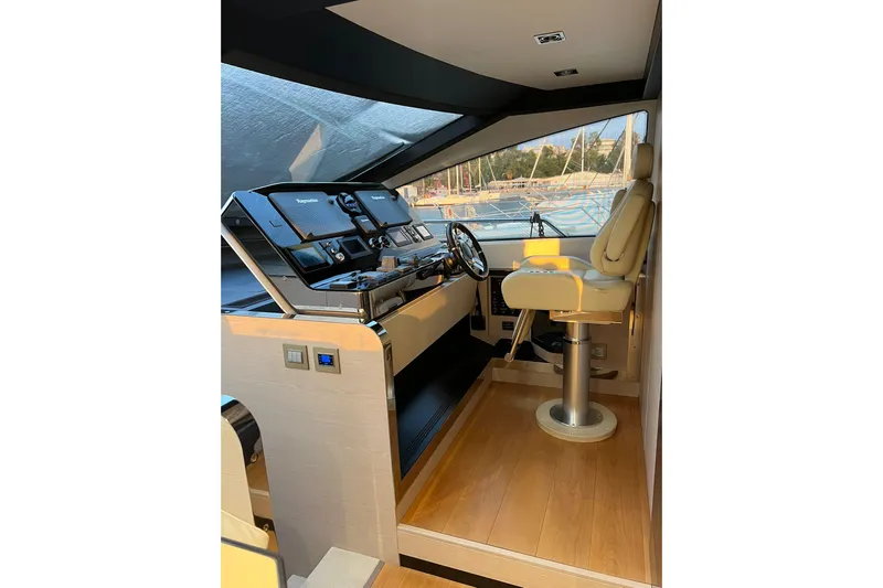  Yacht Photos Pics Luxurious helm of 2015 Azimut 80 yacht with modern controls and leather captain's chair.