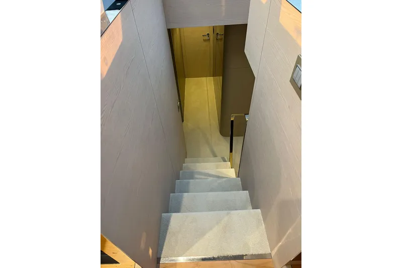  Yacht Photos Pics Staircase inside 2015 Azimut 80 yacht, featuring sleek modern design and wooden paneling.