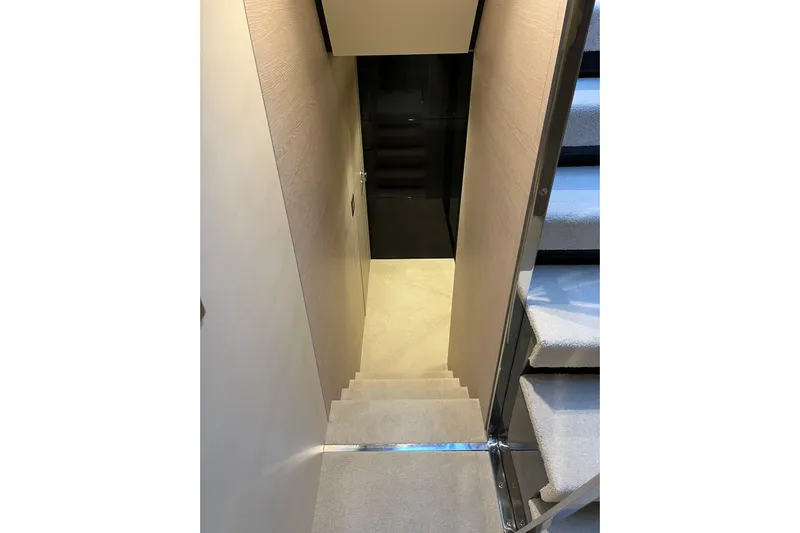  Yacht Photos Pics Staircase inside 2015 Azimut 80 yacht, featuring modern design and plush carpeting.