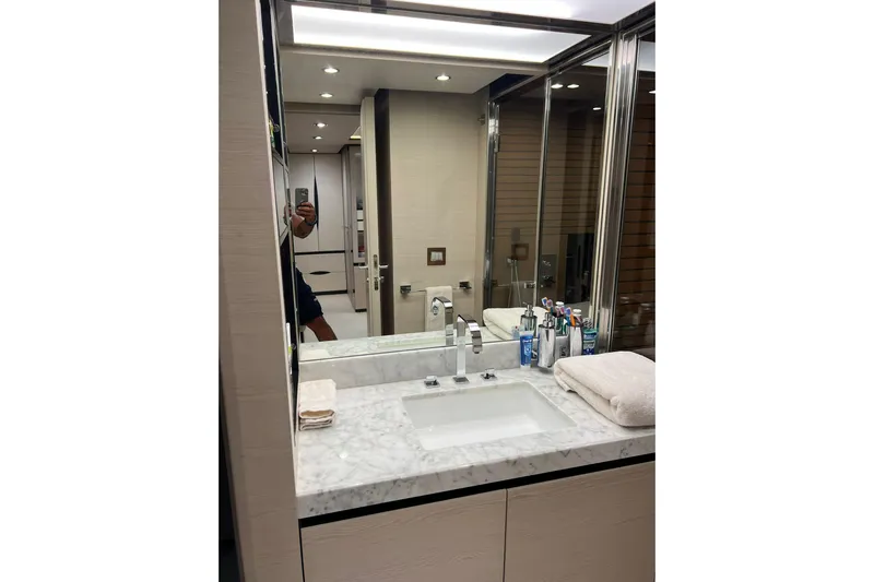  Yacht Photos Pics Luxurious bathroom in 2015 Azimut 80 yacht with marble countertop and modern fixtures.