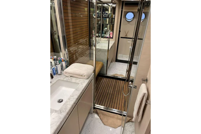  Yacht Photos Pics Luxurious bathroom on 2015 Azimut 80 yacht with marble sink and wooden flooring.