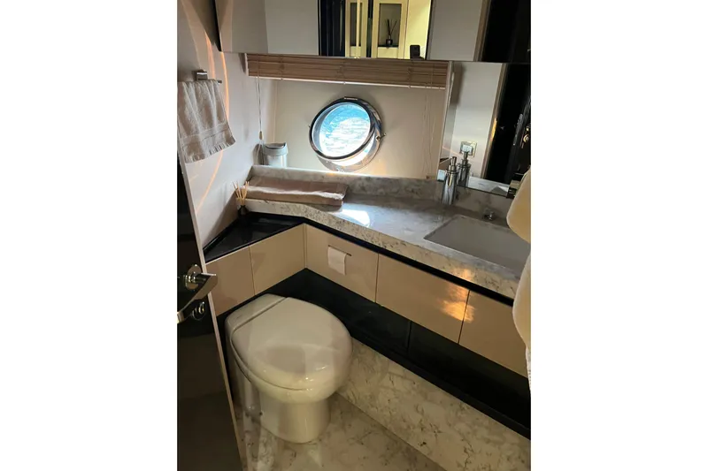  Yacht Photos Pics Luxurious bathroom on 2015 Azimut 80 yacht with marble countertop and ocean view porthole.
