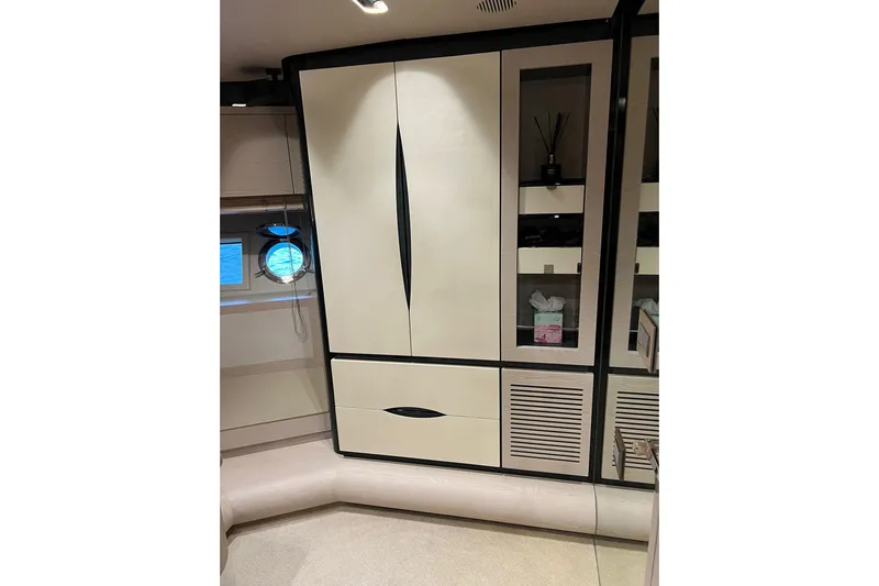  Yacht Photos Pics Luxurious interior of 2015 Azimut 80 yacht with sleek cabinetry and porthole window.