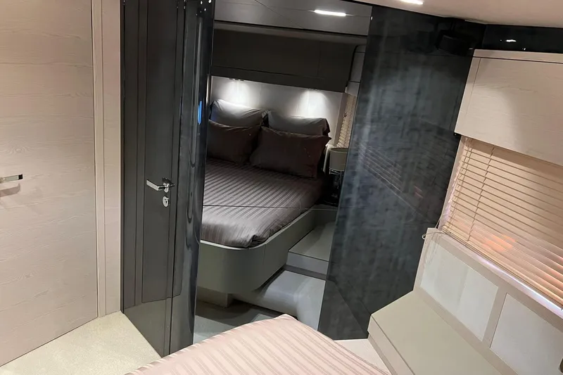  Yacht Photos Pics Luxurious bedroom interior of 2015 Azimut 80 yacht with modern design and cozy bedding.