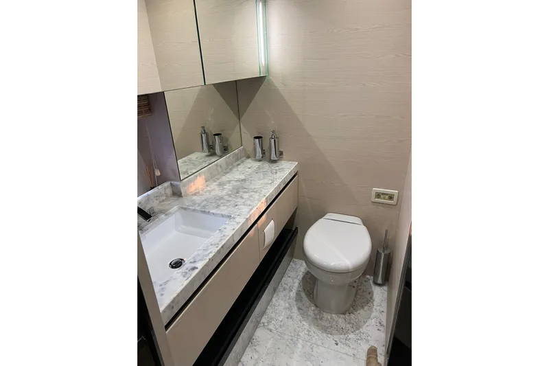  Yacht Photos Pics Luxurious bathroom in 2015 Azimut 80 yacht with marble countertop and modern fixtures.