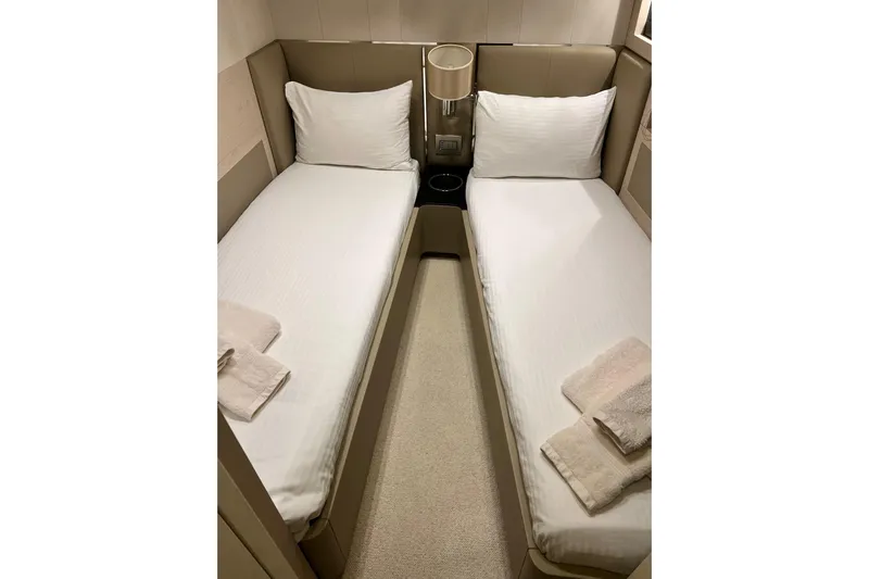  Yacht Photos Pics Twin beds in a 2015 Azimut 80 yacht cabin with modern decor.