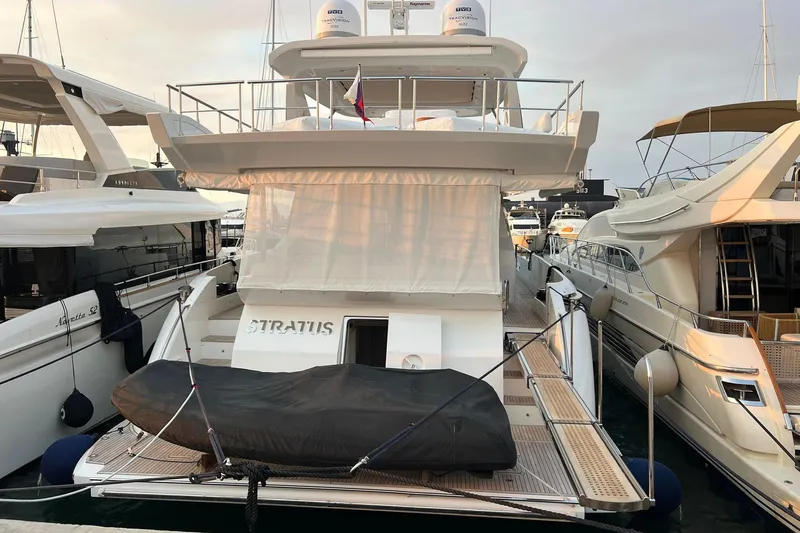  Yacht Photos Pics 2015 Azimut 80 yacht docked at marina, rear view with covered equipment.
