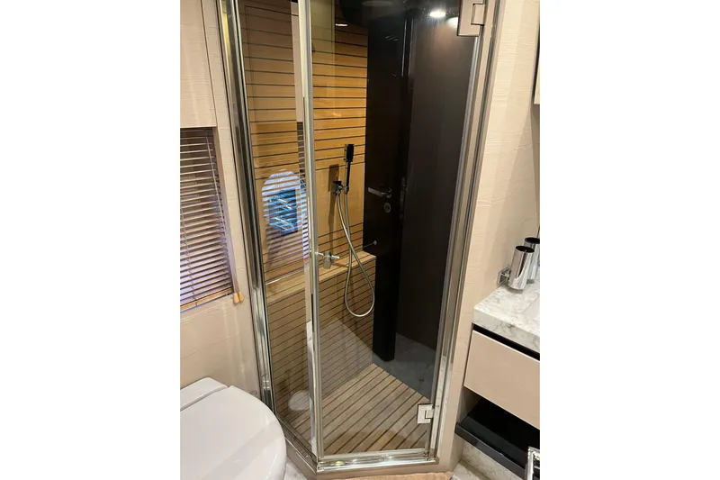  Yacht Photos Pics Luxurious bathroom in 2015 Azimut 80 yacht with modern shower and sleek design.