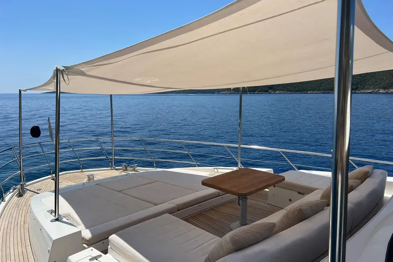  Yacht Photos Pics Luxurious 2015 Azimut 80 yacht deck with sunshade, cushions, and ocean view.
