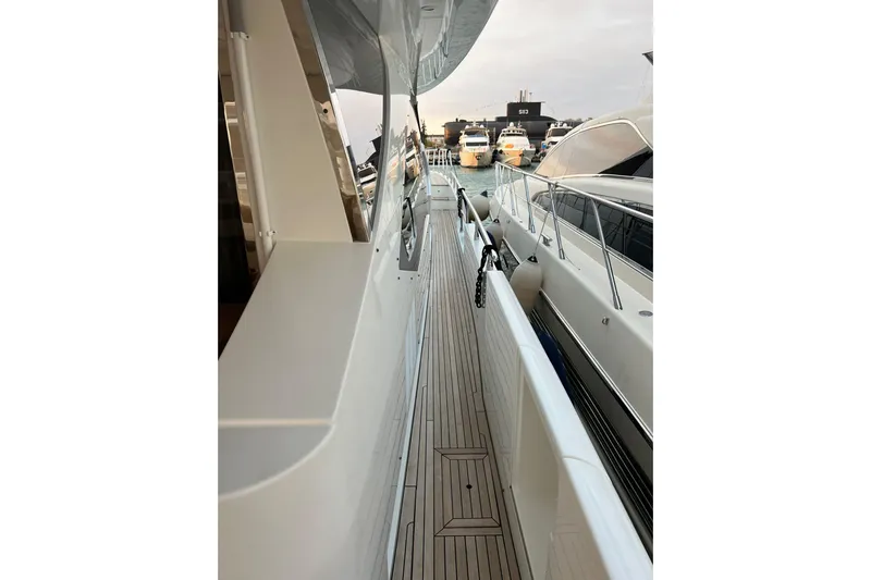  Yacht Photos Pics Side view of a 2015 Azimut 80 yacht docked at a marina.