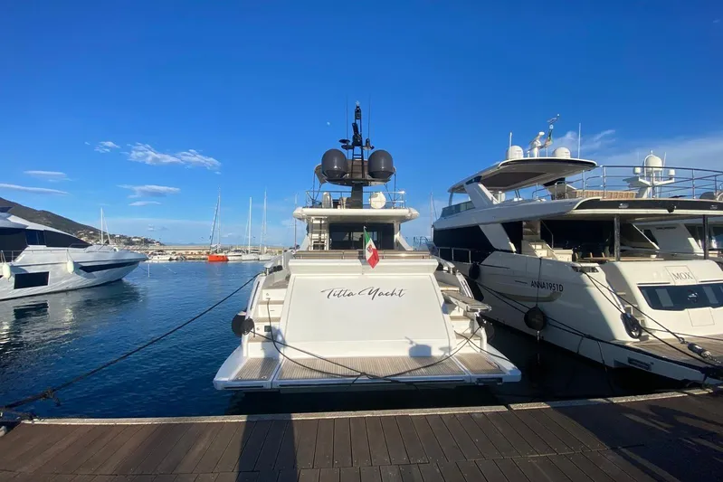  Yacht Photos Pics Luxury 2016 Azimut 77S yacht docked at marina under clear blue sky.