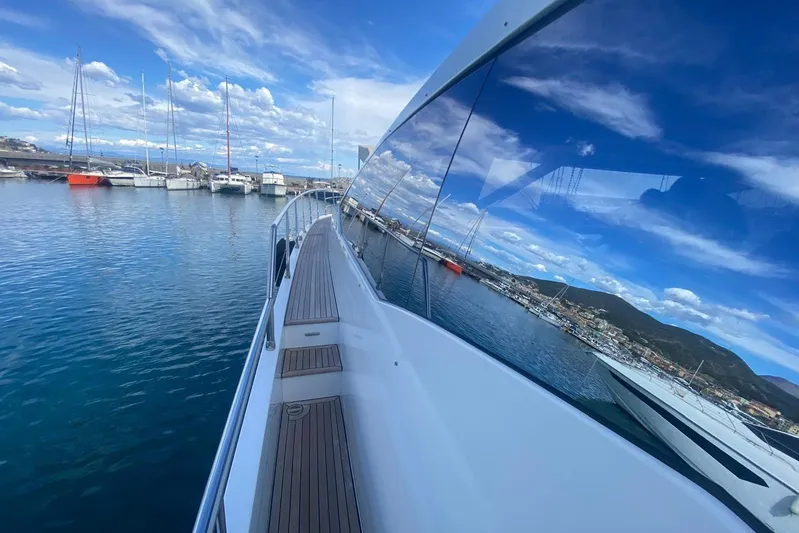  Yacht Photos Pics Azimut 77S yacht, 2016 model, docked with scenic marina view and clear blue sky.
