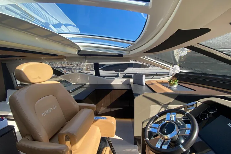  Yacht Photos Pics Luxurious interior of 2016 Azimut 77S yacht with panoramic sunroof and elegant steering area.
