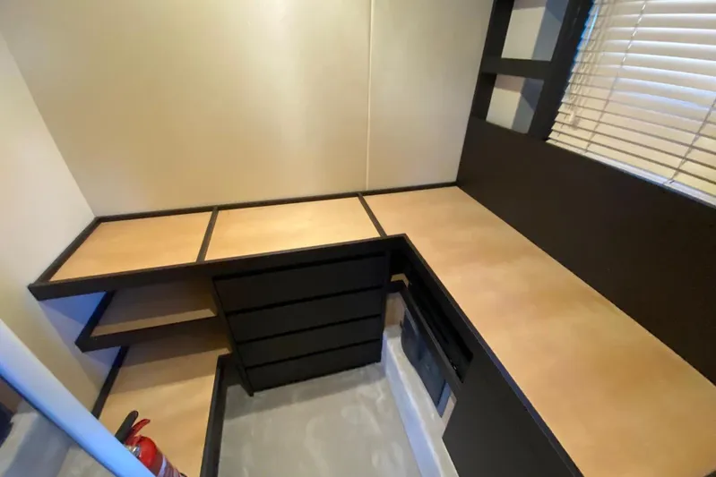  Yacht Photos Pics Interior workspace of 2016 Azimut 77S yacht with wooden countertops and storage.