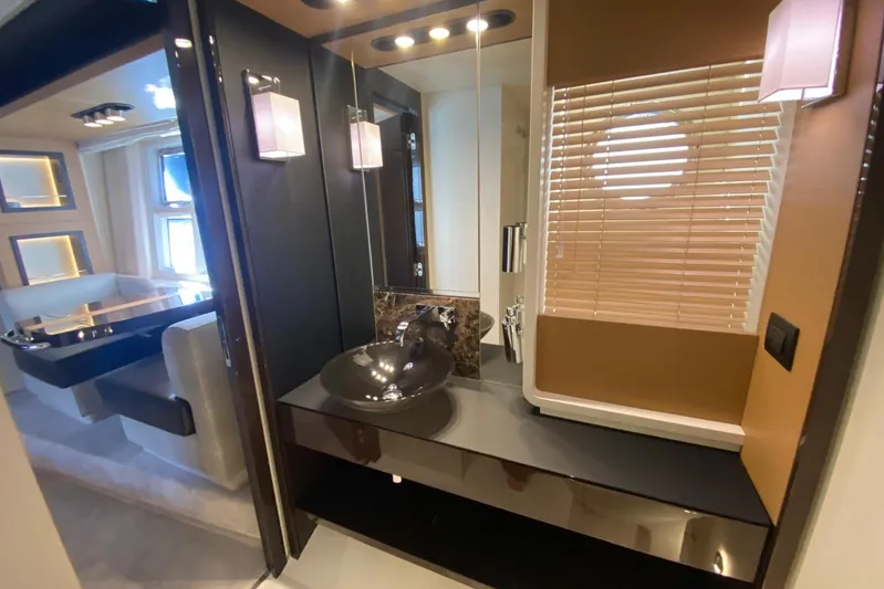  Yacht Photos Pics Luxurious interior of 2016 Azimut 77S yacht featuring modern bathroom and dining area.