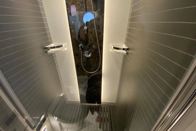  Yacht Photos Pics Luxurious shower interior on a 2016 Azimut 77S yacht, featuring sleek design and modern fixtures.