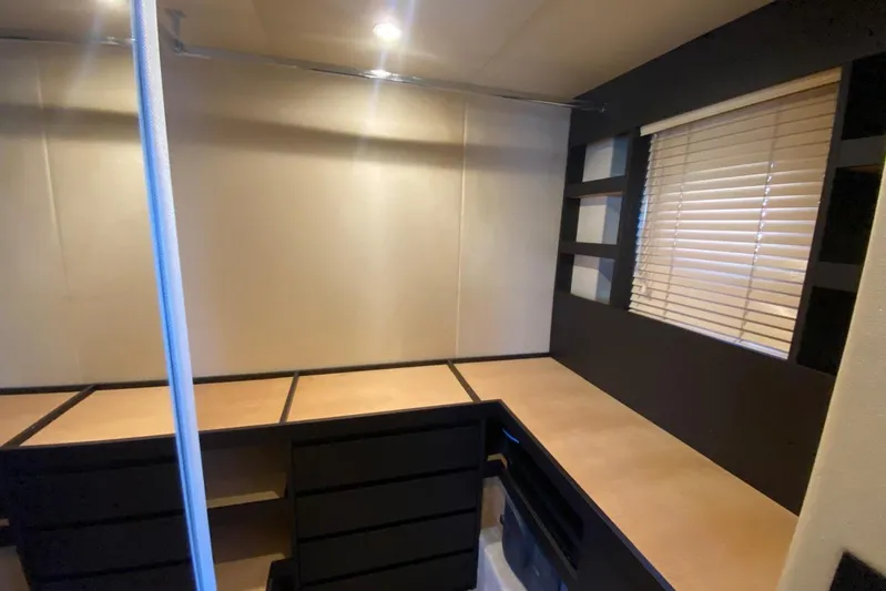  Yacht Photos Pics Interior of 2016 Azimut 77S yacht with modern desk and window blinds.