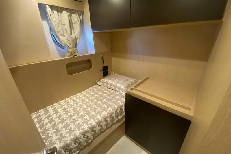  Yacht Photos Pics Compact cabin interior of 2016 Azimut 77S yacht with single bed and porthole window.