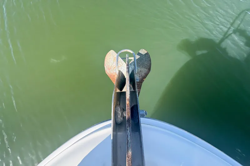 Luna Yacht Photos Pics Bow view of 2008 Sea Ray 380 Sundancer with anchor over green water.